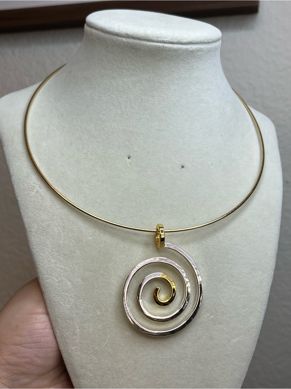 Gold tone dual tone swirl pendant torque collar
